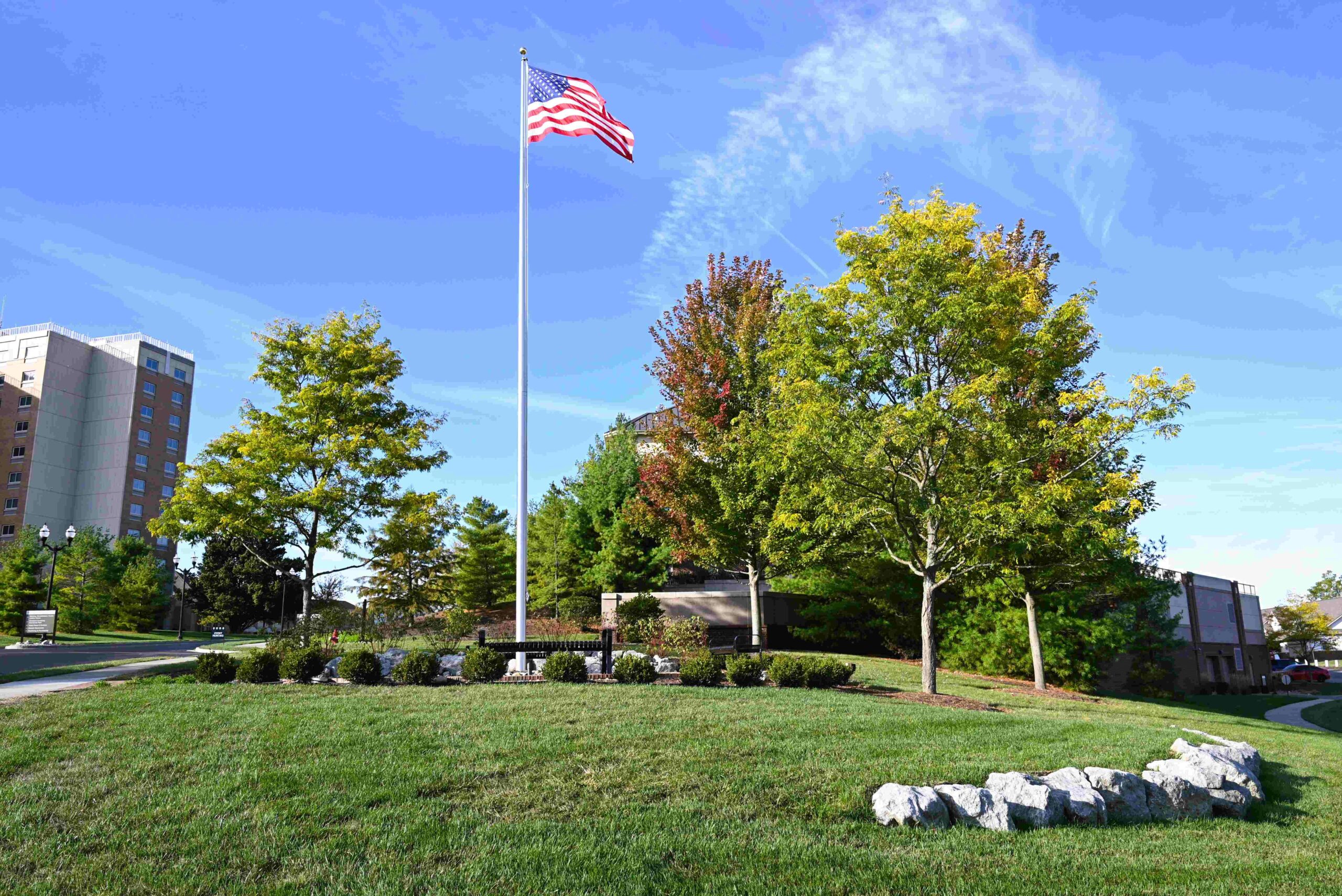 Memorial Patio at Bethany Village features engraved bricks, benches surrounding American flag on a pole