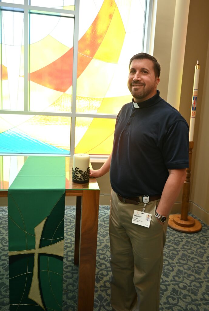 Rev. Scott Nellis stands at the pulpit at Bethany Village